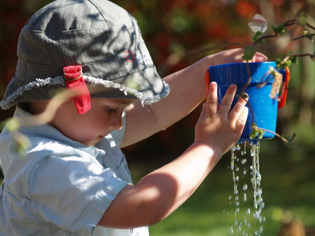 child playing with water